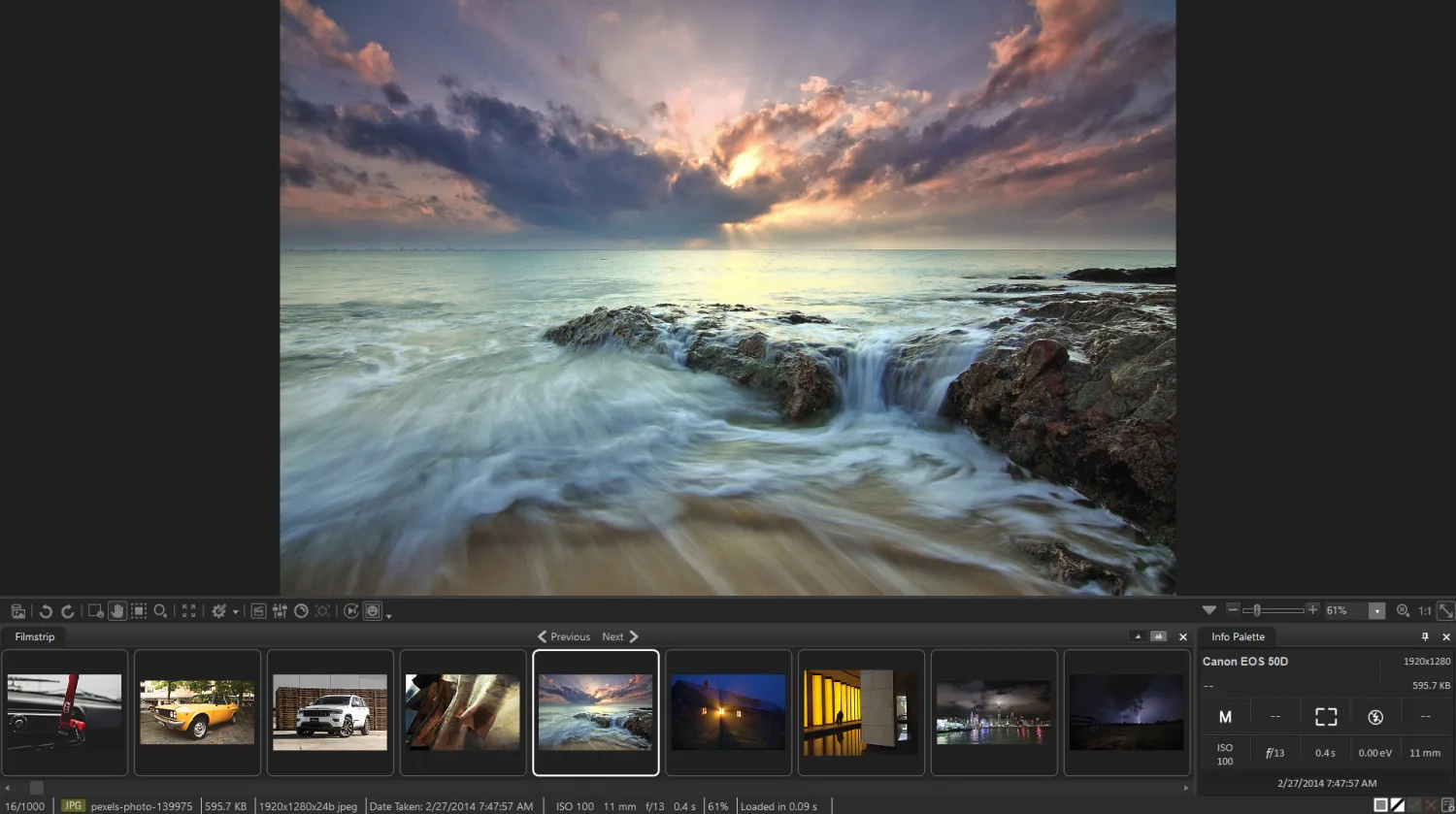 A long-exposure seascape at sunset in a photo viewer with filmstrip and camera info palette