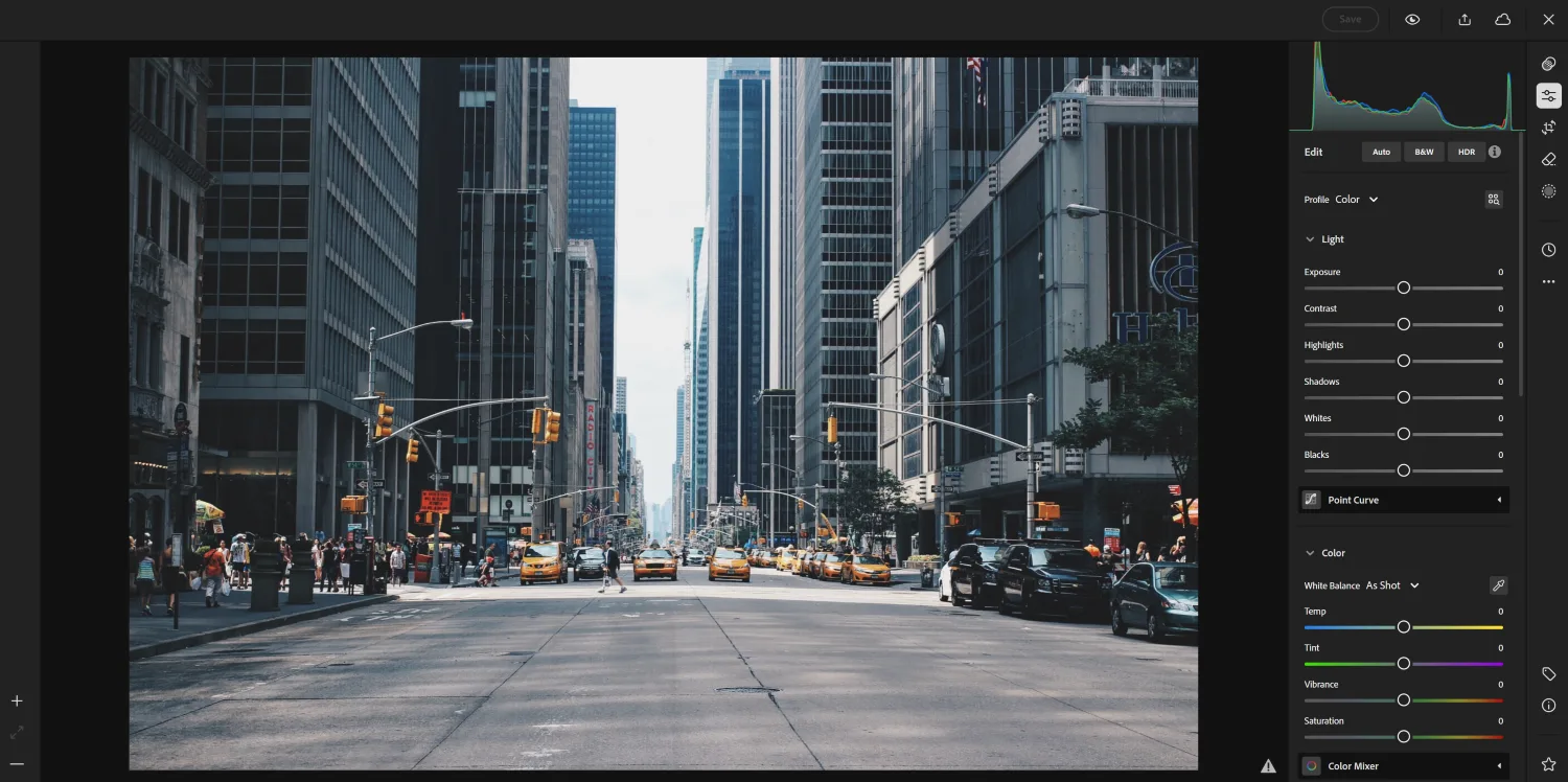 Adobe Lightroom with editing tools and an image of a city street